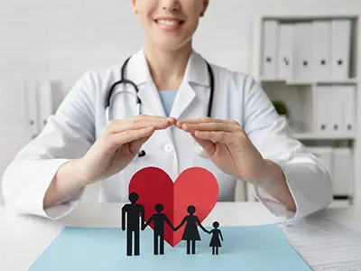 Doctor symbolically protecting a family with a heart shape, representing holistic general health at Dr. Jyoti Dharmdas Homeo Clinic, Bhopal, under Dr. Renu Rajput Barigal, the best homeopathy doctor in Bhopal.